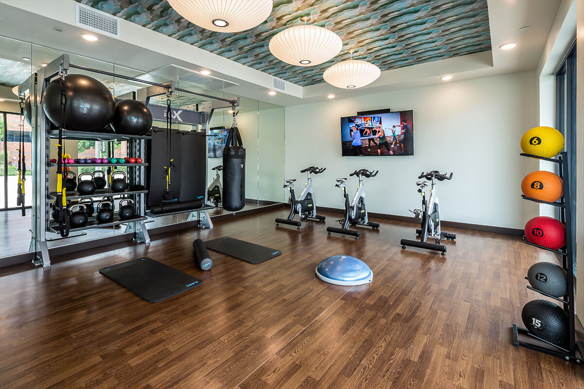 Fitness center with free weights and cardio equipment