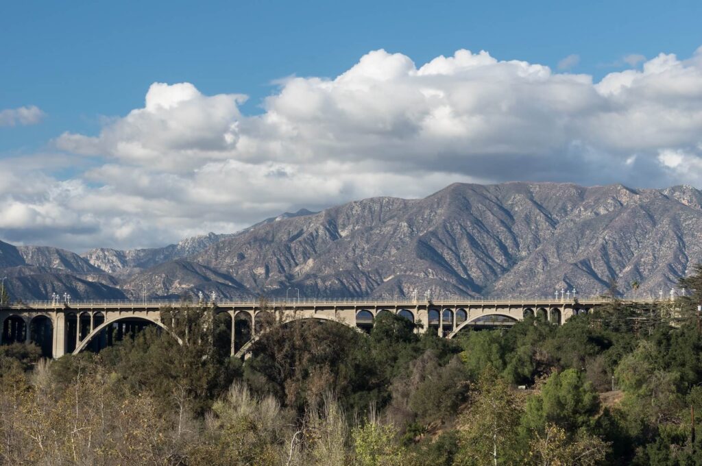 View of mountains with a bridge in the foreground